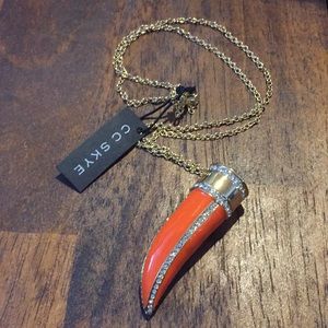 Cc sky orange save the elephants tusk necklace